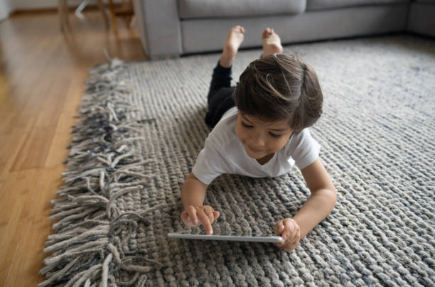 Girl lying on rug | Custom Carpet Centers