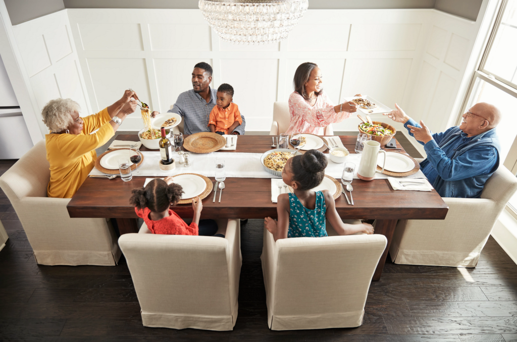 Happy family enjoying breakfast | Custom Carpet Centers